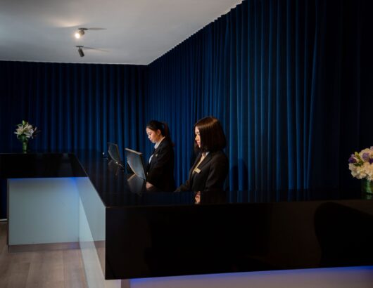 Two Women at Reception Area